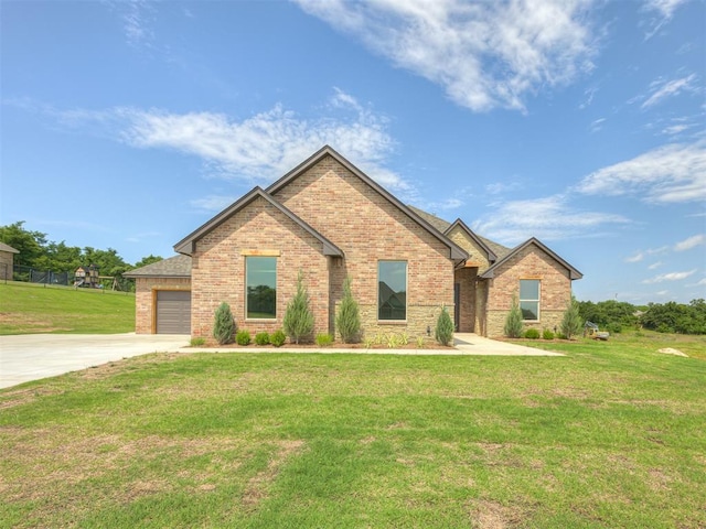 7625 Leoma Ln, Oklahoma City, OK 73150 - view of front of home with brick siding, driveway, and a front yard