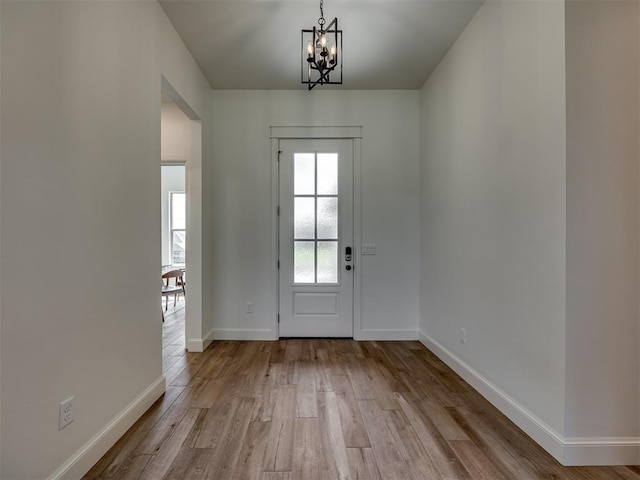 7625 Leoma Ln, Oklahoma City, OK 73150 - entrance foyer with a chandelier and wood finished floors