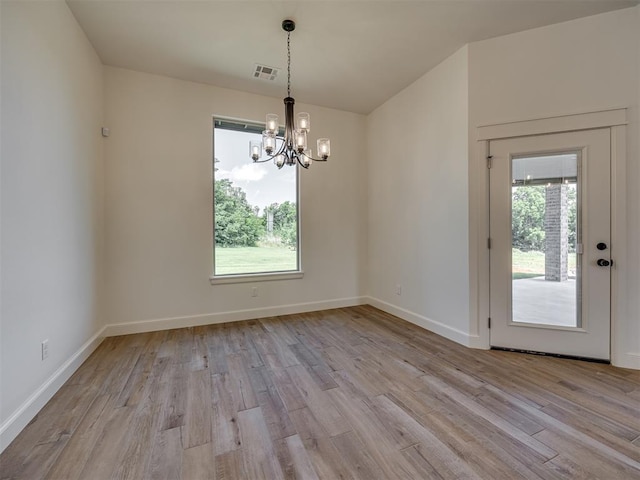 7625 Leoma Ln, Oklahoma City, OK 73150 - unfurnished dining area with a chandelier and light wood-style floors