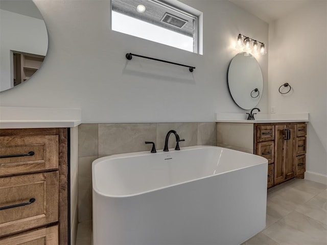 7625 Leoma Ln, Oklahoma City, OK 73150 - full bathroom with a freestanding tub, vanity, and tile patterned flooring
