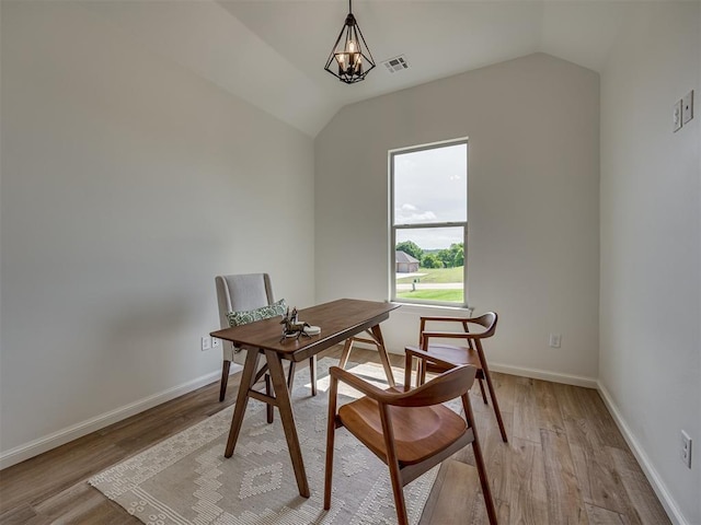 7625 Leoma Ln, Oklahoma City, OK 73150 - dining room featuring light wood finished floors, vaulted ceiling, a desk, and a chandelier
