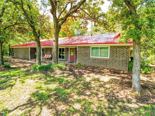 114 Timber Ln, Mcloud, OK 74851 - single story home with brick siding and a metal roof