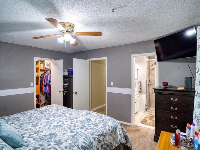 114 Timber Ln, Mcloud, OK 74851 - bedroom featuring light colored carpet, a walk in closet, ceiling fan, a closet, and connected bathroom