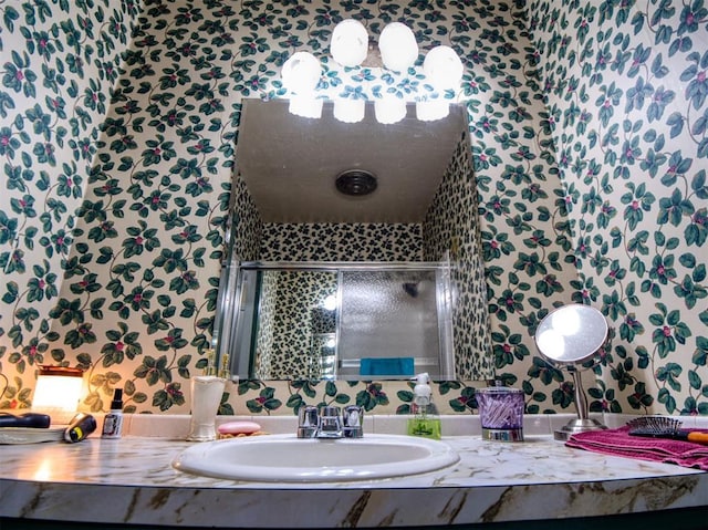 114 Timber Ln, Mcloud, OK 74851 - full bathroom featuring wallpapered walls, vanity, and a shower stall