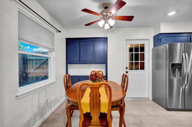 12414 SW 15th Ter, Yukon, OK 73099 - dining area featuring ceiling fan and light tile patterned floors