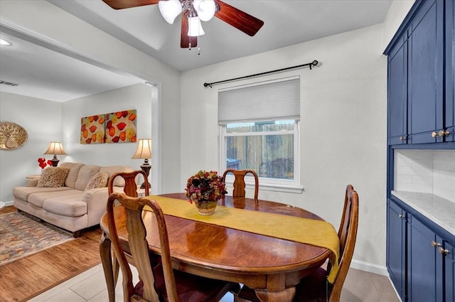 12414 SW 15th Ter, Yukon, OK 73099 - dining space featuring ceiling fan and light tile patterned floors