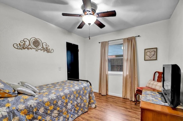 12414 SW 15th Ter, Yukon, OK 73099 - bedroom with light wood-style flooring and ceiling fan