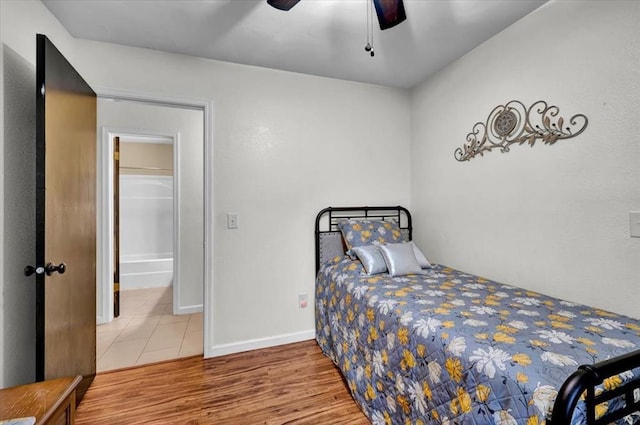 12414 SW 15th Ter, Yukon, OK 73099 - bedroom with wood finished floors and a ceiling fan