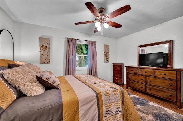 12414 SW 15th Ter, Yukon, OK 73099 - bedroom with wood finished floors and ceiling fan