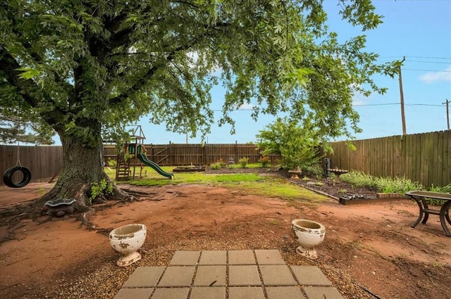 12414 SW 15th Ter, Yukon, OK 73099 - fenced backyard with a playground