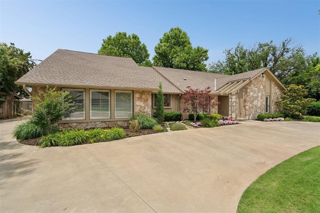 11209 Thorn Ridge Rd, Oklahoma City, OK 73120 - view of front of property featuring stone siding and roof with shingles
