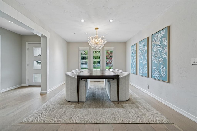 11209 Thorn Ridge Rd, Oklahoma City, OK 73120 - dining space featuring a chandelier, wood finished floors, and recessed lighting
