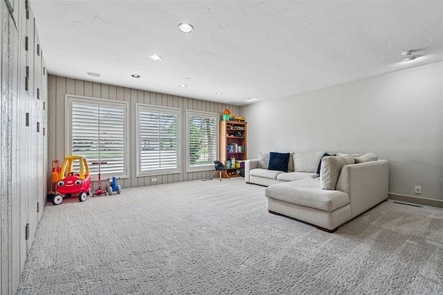 11209 Thorn Ridge Rd, Oklahoma City, OK 73120 - carpeted living room featuring recessed lighting and a textured ceiling