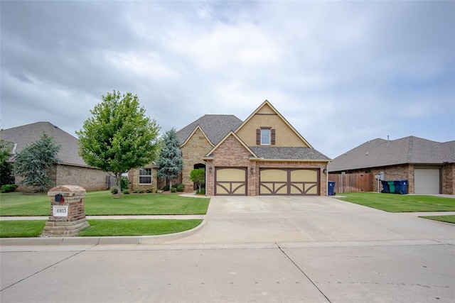 6813 Chelsey Ln, Oklahoma City, OK 73132 - traditional-style home featuring concrete driveway and brick siding
