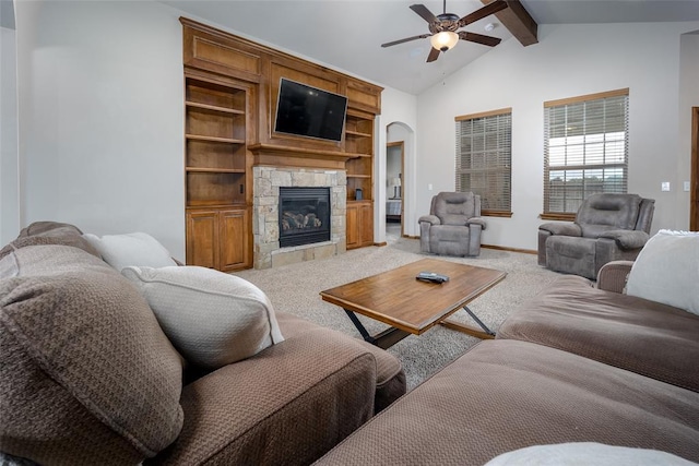 6813 Chelsey Ln, Oklahoma City, OK 73132 - living area with ceiling fan, light carpet, a stone fireplace, arched walkways, and built in features