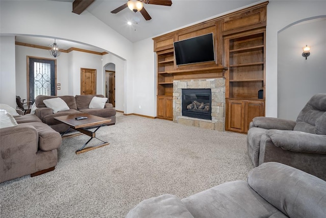 6813 Chelsey Ln, Oklahoma City, OK 73132 - living room featuring arched walkways, a ceiling fan, light colored carpet, and a stone fireplace