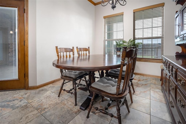 6813 Chelsey Ln, Oklahoma City, OK 73132 - dining space featuring a heating unit, crown molding, and a chandelier