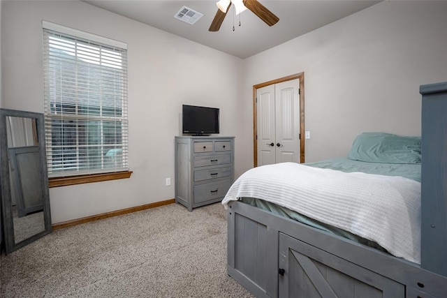 6813 Chelsey Ln, Oklahoma City, OK 73132 - bedroom featuring light carpet, a closet, and ceiling fan