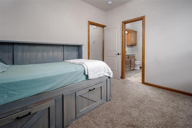6813 Chelsey Ln, Oklahoma City, OK 73132 - bedroom with light colored carpet and ensuite bathroom