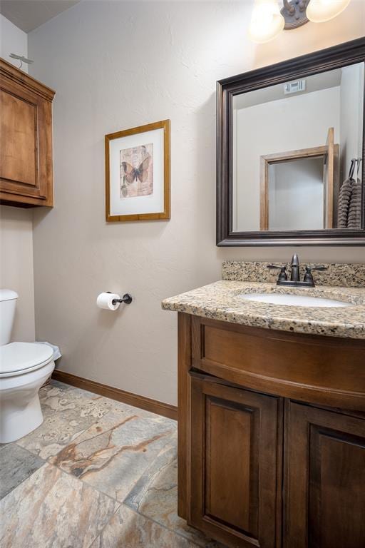 6813 Chelsey Ln, Oklahoma City, OK 73132 - bathroom featuring vanity and stone finish flooring
