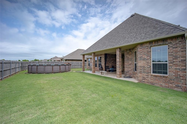 6813 Chelsey Ln, Oklahoma City, OK 73132 - fenced backyard featuring a patio