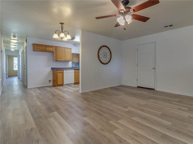 524 E Grant Ave, Guthrie, OK 73044 - unfurnished living room featuring light wood-style floors, a ceiling fan, and a chandelier