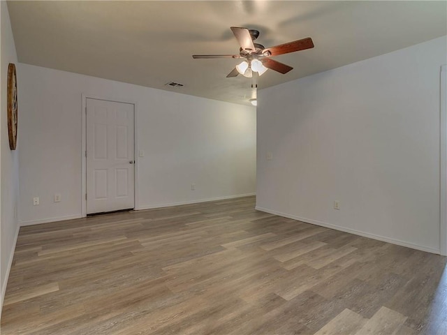 524 E Grant Ave, Guthrie, OK 73044 - empty room with ceiling fan and light wood finished floors
