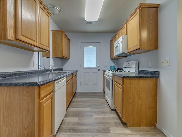 524 E Grant Ave, Guthrie, OK 73044 - kitchen featuring white appliances, dark countertops, and light wood finished floors