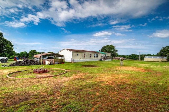 910903 S 3444th Rd, Chandler, OK 74834 - view of green lawn featuring a detached carport