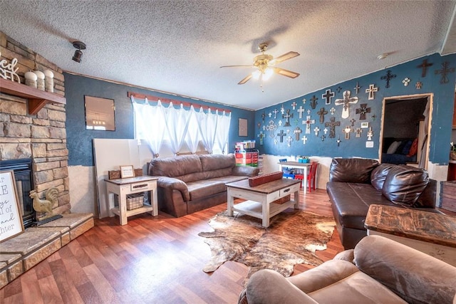 910903 S 3444th Rd, Chandler, OK 74834 - living room featuring wallpapered walls, wood finished floors, a textured ceiling, ceiling fan, and vaulted ceiling