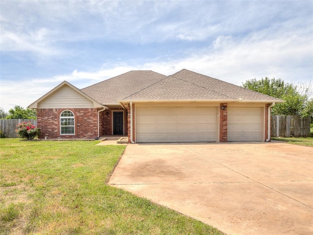 3922 Deer Xing, Edmond, OK 73025 - single story home with brick siding, driveway, a garage, and a shingled roof