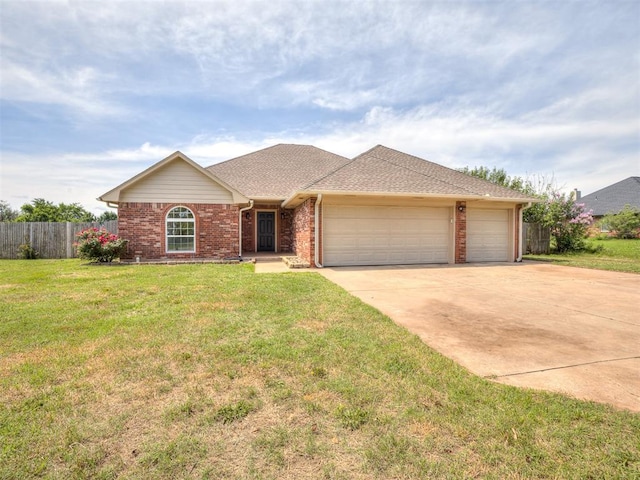 3922 Deer Xing, Edmond, OK 73025 - ranch-style home with a garage, brick siding, and concrete driveway
