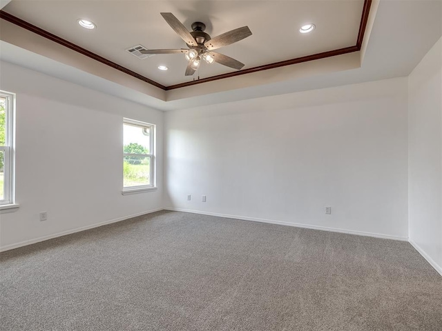 3922 Deer Xing, Edmond, OK 73025 - carpeted spare room with ornamental molding, healthy amount of natural light, ceiling fan, a raised ceiling, and recessed lighting