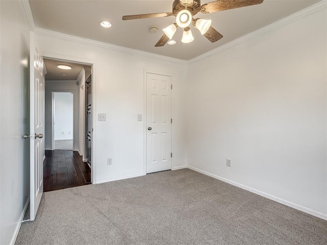 3922 Deer Xing, Edmond, OK 73025 - unfurnished bedroom with dark colored carpet, crown molding, recessed lighting, and a ceiling fan