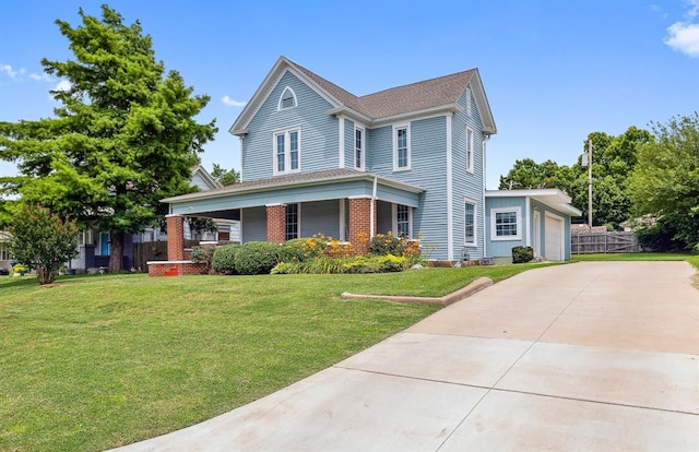 811 S Barker Ave, El Reno, OK 73036 - view of front of property featuring covered porch, a garage, and concrete driveway