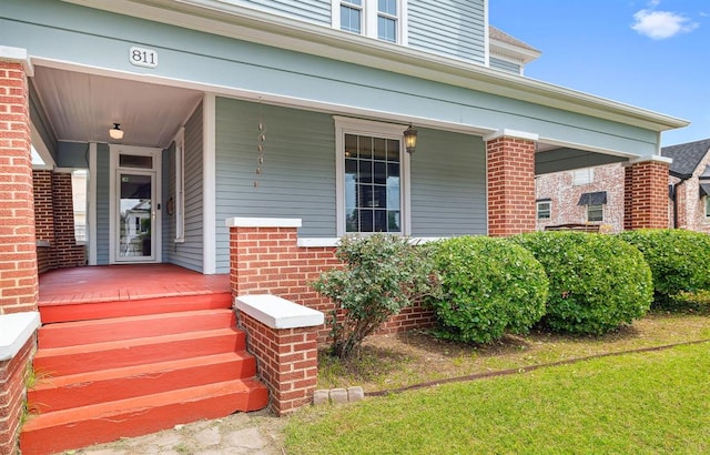 811 S Barker Ave, El Reno, OK 73036 - property entrance with a porch and brick siding