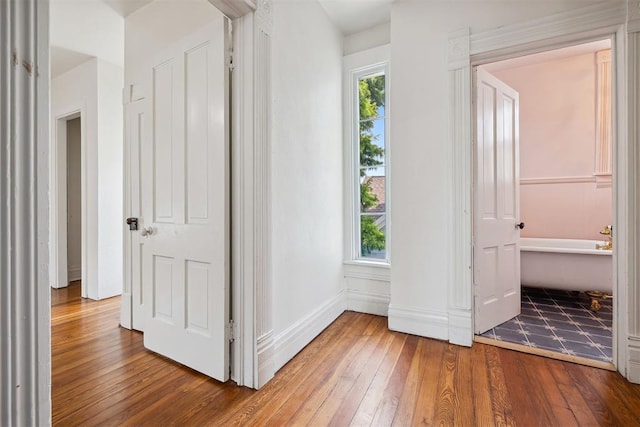 811 S Barker Ave, El Reno, OK 73036 - unfurnished bedroom featuring wood-type flooring and baseboards