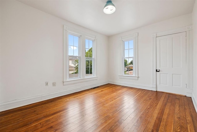 811 S Barker Ave, El Reno, OK 73036 - unfurnished room featuring wood-type flooring and baseboards