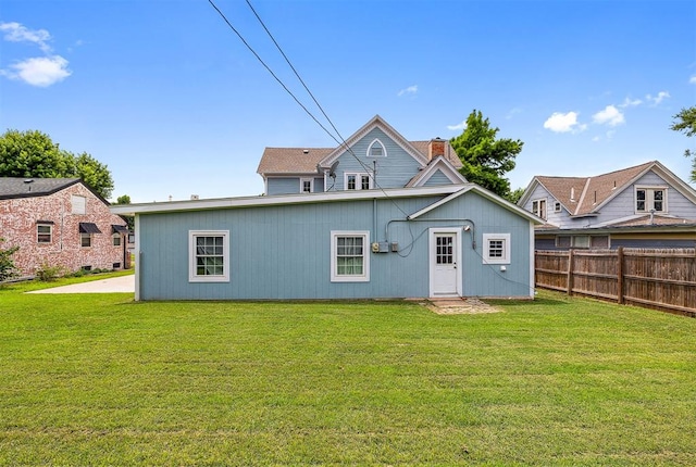 811 S Barker Ave, El Reno, OK 73036 - rear view of house featuring a chimney