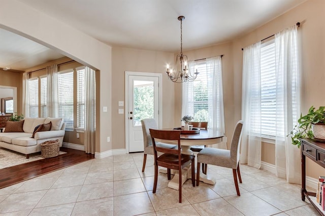 637 Branch Line Rd, Yukon, OK 73099 - dining space with a chandelier and light tile patterned floors