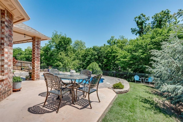 637 Branch Line Rd, Yukon, OK 73099 - fenced backyard with a patio area and outdoor dining space