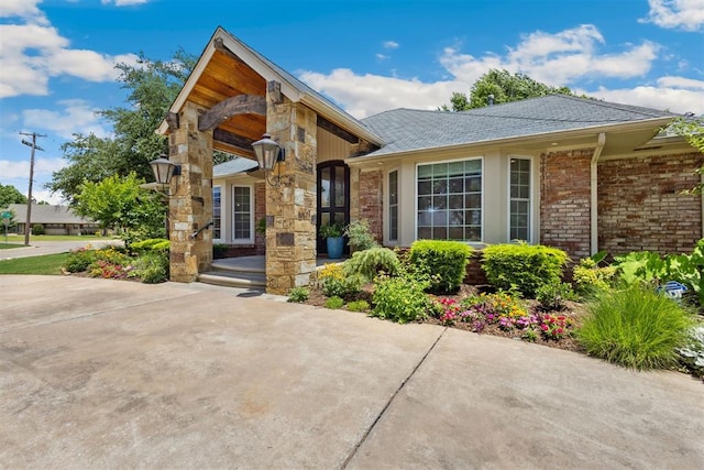 8700 N Waverly Ave, Oklahoma City, OK 73120 - view of front facade with a shingled roof and brick siding