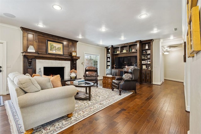 8700 N Waverly Ave, Oklahoma City, OK 73120 - living room featuring crown molding, a fireplace, dark wood-style floors, and recessed lighting