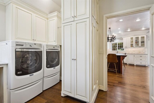 8700 N Waverly Ave, Oklahoma City, OK 73120 - washroom with separate washer and dryer, cabinet space, dark wood-style floors, a chandelier, and recessed lighting