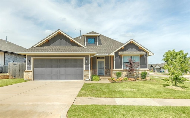 17817 Morning Sky Ct, Edmond, OK 73012 - craftsman inspired home featuring a garage, stone siding, roof with shingles, and driveway