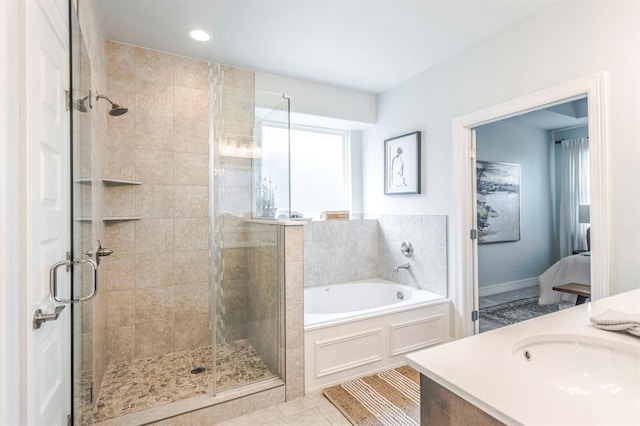 17817 Morning Sky Ct, Edmond, OK 73012 - ensuite bathroom with a bath, a stall shower, vanity, tile patterned floors, and recessed lighting