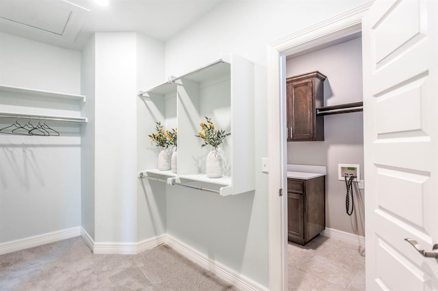 17817 Morning Sky Ct, Edmond, OK 73012 - walk in closet featuring light carpet