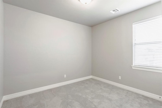 17817 Morning Sky Ct, Edmond, OK 73012 - empty room featuring light colored carpet and baseboards