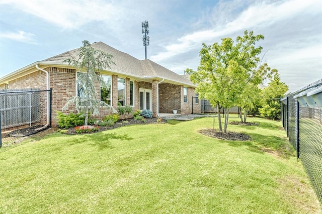17817 Morning Sky Ct, Edmond, OK 73012 - rear view of house featuring brick siding and a fenced backyard
