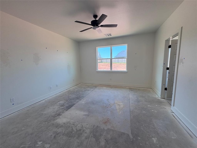 6101 Kinnick Dr, Edmond, OK 73034 - empty room featuring unfinished concrete flooring and a ceiling fan